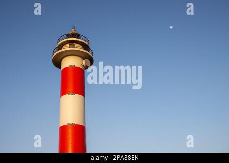 Traditional design with white and red stripes. The newest lighthouse of three of them in the northwest part of the island. El Cotillo, Fuerteventura, Stock Photo