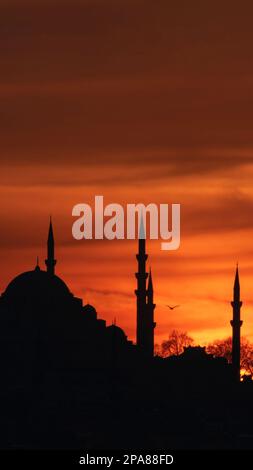 Ramadan vertical photo. Suleymaniye Mosque and dramatic clouds at sunset. Ramadan or kadir gecesi or laylat al-qadr concept vertical story photo. Stock Photo