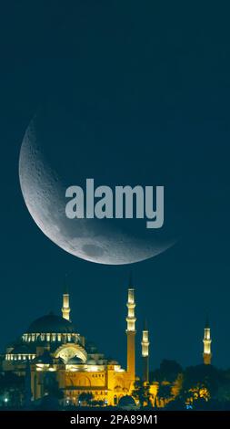 Suleymaniye Mosque and crescent moon. Ramadan concept vertical photo. Islamic or kadir gecesi or laylat al-qadr concept vertical story photo. Stock Photo