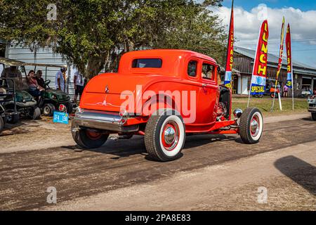 Fort Meade, FL - February 26, 2022: Low perspective rear corner view of a 1932 Ford 5 Window Coupe Hot Rod at a local car show. Stock Photo