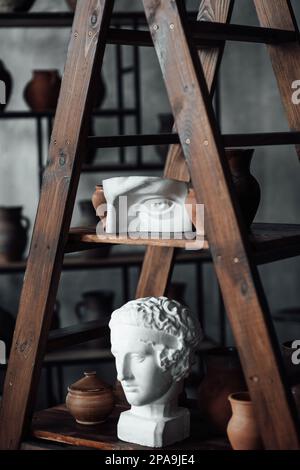 Art objects for exhibition of classical and contemporary painting retro sculpture and pottery. Hand illustrations plaster bust statues and abstract sh Stock Photo