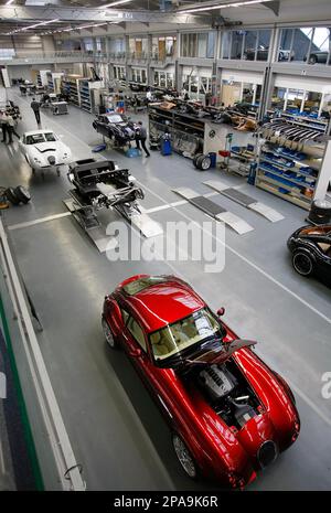 A worker assembles a sports car at the new factory of German car company  Wiesmann in Duelmen, Germany, Wednesday, April 2, 2008. Wiesmann creates  and handcrafts exclusive sport cars in a retro