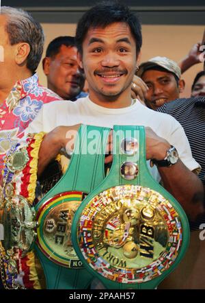 Boxer Manny Pacquiao Of The Philippines Displays His WBO Championship Belt At The Official Weigh