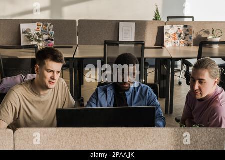 Programmers working in the office of a software development company. Coding technologies, site design. Successful diverse Teamwork. Cyberspace concept Stock Photo