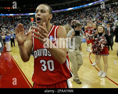 Davidson Wildcats' Stephen Curry (30) celebrates his team's 82-76