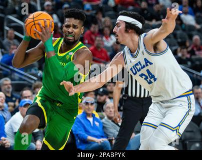 March 10 2023 Las Vegas, NV, U.S.A. Oregon guard Jermaine Couisnard (5)goes to the hoop during the NCAA Pac 12 Men's Basketball Tournament Semifinals between Oregon Ducks and the UCLA Bruins. UCLA beat Oregon 75-56 at T Mobile Arena Las Vegas, NV. Thurman James/CSM Stock Photo