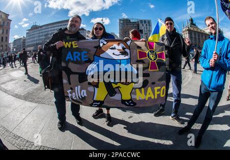 Munich, Bavaria, Germany. 11th Mar, 2023. A flag of NAFO, an anti-propaganda group that combats Russian trolls with memes and facts. As Russia pounds cities across Ukraine with waves of hypersonic missiles, Ukrainians and Germans in Munich, Germany made demands for peace and the immediate withdrawal of Russia from Ukrainian territory. The participants also thanked Germany and the alliance for the support for Ukrainian refugees, humanitarian aid for those in Ukraine, and for the defensive weapons. (Credit Image: © Sachelle Babbar/ZUMA Press Wire) EDITORIAL USAGE ONLY! Not for Commercial USAGE! Stock Photo