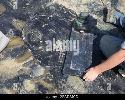 HDPE landfill liner patch installed on a bad weld seam being vacuum tested for leaks. Stock Photo