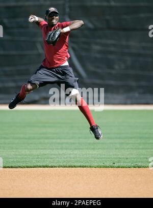 Arizona Diamondbacks second baseman Orlando Hudson, left, regains his  balance after San Diego Padres' Dave Roberts was unable to keep Hudson from  completing a double play during a baseball game Tuesday, May