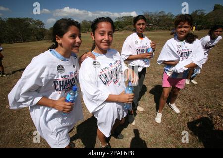 Members of Buena Vista soccer team wear donated T-shirts hailing the New  England Patriots as Super Bowl Champions, 19-0'' in San Gregorio, south of  Managua, Thursday, Feb. 14, 2008. The NFL donated