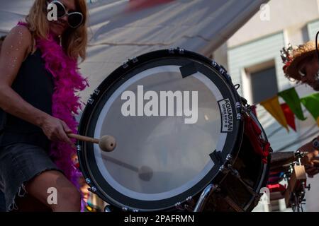 Saint-Gilles les bains, La Réunion - June 25 2017: Drummer playing with a bass drum with the Reunion Island flag painted on it during the carnival of Stock Photo