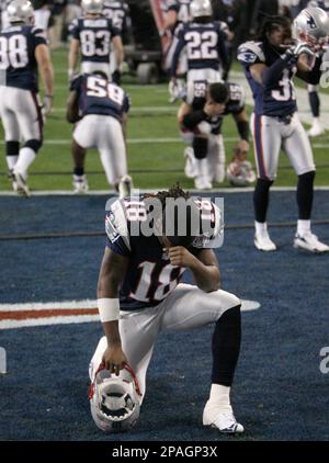 Washington Redskins wide receiver Donte' Stallworth (19) is tackled by New  England Patriots cornerback Devin McCourty (32), rear, Julian Edelman (11)  during the first half at FedEx Field in Landover, MD, Sunday