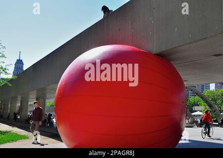 Toronto, Ontario, Canada - 06/12/2009: Art display in Toronto City Hall - RedBall is a travelling public art piece by American artist Kurt Perschke Stock Photo