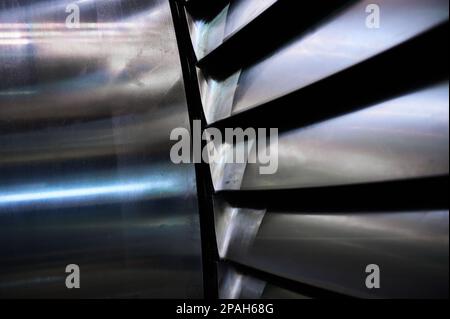 Powerful steam turbine shaft with installed long blades Stock Photo