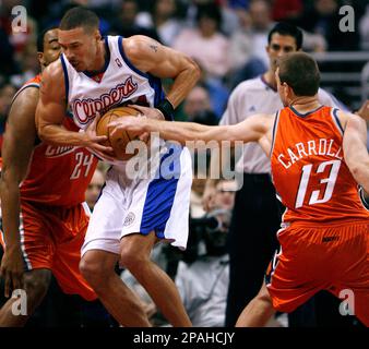 Los Angeles Clippers Aaron Williams center is double teamed by