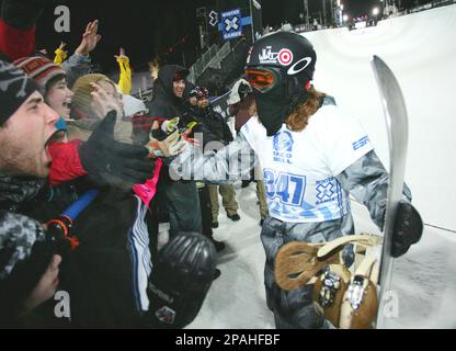 Shaun White, left, of Carlsbad, Calif., shouts after winning the men's  halfpipe finals at the Burton U.S. Open Snowboarding Championships,  Saturday, March 22, 2008, at Stratton Mountain Resort in Stratton, Vt. (AP