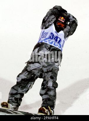 Snowboarder Shaun White, of Carlsbad, Calif., raises his arms at the bottom  of the superpipe after winning tonight's competition on Sunday, Jan., 27,  2008, at the Winter X Games at Buttermilk Ski