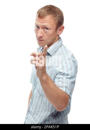 Confidence grows with age. A cropped portrait of a stern middle-aged man pointing at the camera isolated on white. Stock Photo