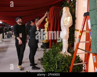 Los Angeles, USA. 11th Mar, 2023. Workers prepare the entrance area on Hollywood Boulevard in front of the Dolby Theatre for the 95th Academy Awards. Credit: Barbara Munker/dpa/Alamy Live News Stock Photo