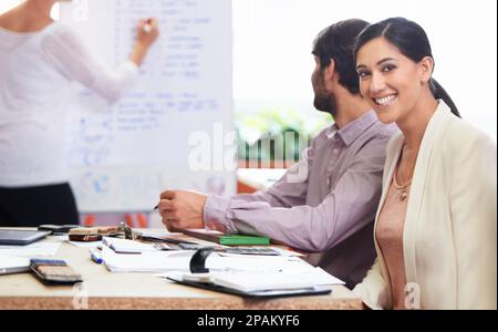 Getting the job done. three business associates working together on a project. Stock Photo