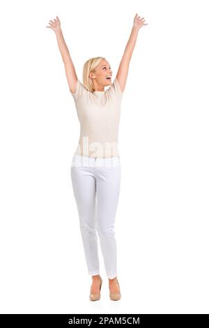 I did it. A happy young blonde woman smiling with her hands in the air. Stock Photo