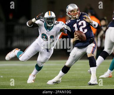 Miami Dolphins defensive tackle Vonnie Holliday, 91, chases San Diego  Chargers quarterback Drew Brees, 7, out of the pocket during the fourth  quarter, December 11, 2005, in Qualcomm Stadium in San Diego.