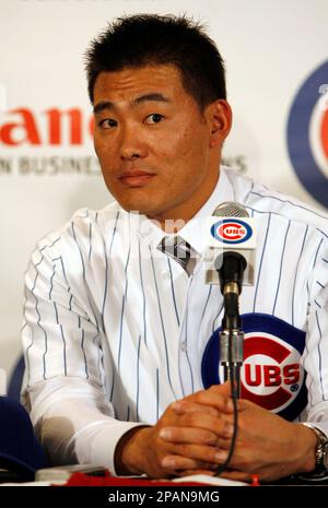 Japanese free agent outfielder Kosuke Fukudome, left, shows his new team  jersey with the Chicago Cubs manager Jim Hendry at Wrigley Field,  Wednesday, Dec. 19, 2007, in Chicago. (AP Photo/Nam Y. Huh