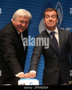 Russian First Deputy Prime Minister and natural gas giant Gazprom Board Chairman Dmitry Medvedev, right, and German Foreign Minister Frank-Walter Steinmeier push a ceremonial button in Gazprom's headquarters in Moscow, Tuesday, Dec. 18, 2007. Russia's state natural gas monopoly OAO Gazprom on Tuesday formally began production at a vast field in western Siberia that is to be a key source of gas for the Nord Stream pipeline project supplying Western Europe. (AP Photo)