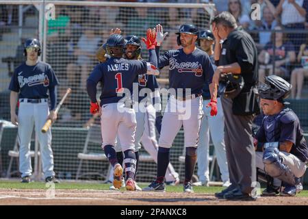 March 11, 2023, North Port FL USA; Atlanta Braves second baseman Ozzie Albies (1) homers in the bottom of the second inning during an MLB spring train Stock Photo