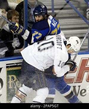 St. Louis Blues Jay McKee (L) pushes Chicago Blackhawks Jassen Cullimore  off of the puck in the first period at the Scottrade Center in St. Louis on  January 4, 2007. (UPI Photo/Bill