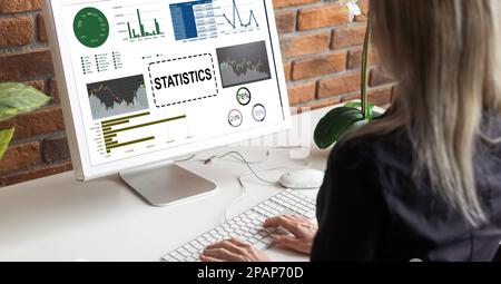 Laptop Computer Showing Statistical Infographics Stands on a Desk in the Living Room. In the Background Cozy Living Room. Stock Photo