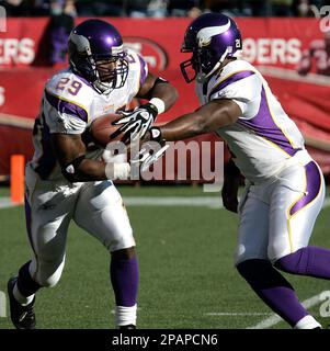 FILE- In this file photo taken Aug. 25, 2010, in Seattle, Minnesota Vikings  running back Chester Taylor runs pushing off Seattle Seahawks' Chuck Darby.  Taylor, who is now with the Chicago Bears