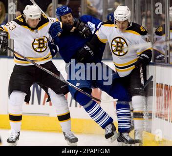 https://l450v.alamy.com/450v/2papfgm/toronto-maple-leafs-defenseman-hal-gill-center-is-checked-by-boston-bruins-jeremy-reich-left-and-brandon-bochenski-during-second-period-nhl-hockey-action-in-toronto-saturday-dec-8-2007-ap-photothe-canadian-press-adrian-wyld-2papfgm.jpg