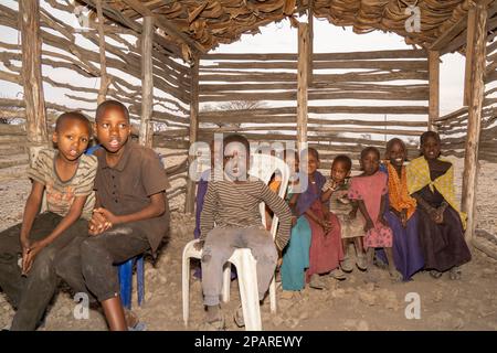 Karatu, Tanzania - October 16th, 2022: A group of masai children in their village's multi age, one classroom school. Stock Photo
