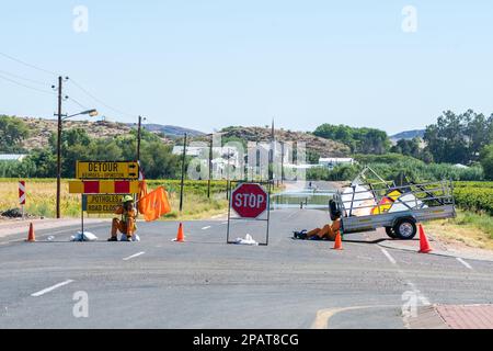 Keimoes, South Africa - Feb 28 2023:The Keimoes to Kenhardt road flooded by the Orange River at Keimoes. The road is closed Stock Photo