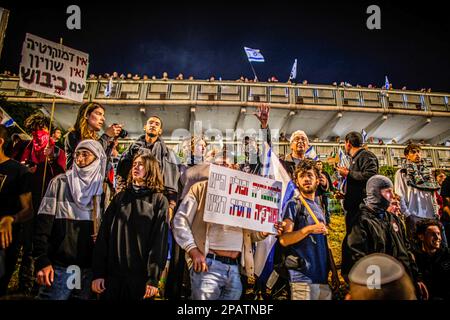 Tel Aviv, Israel. 11th Mar, 2023. Israeli pro democracy protesters gather during the demonstration. Protesters took to the streets, as anti-judicial reform protests entered their tenth consecutive week. Credit: SOPA Images Limited/Alamy Live News Stock Photo