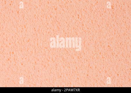 Simple gently light orange, creamy, pink ethylene vinyl acetate foam, foamiran texture. High resolution photo texture of material. Stock Photo