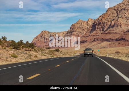 A picture of the U.S. Route 89 in Arizona and its rock formation landscape. The truck is a RAM 1500 Laramie 4x4. Stock Photo