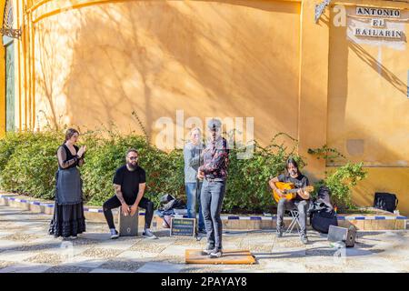 Seville, Spain - March 11, 2023: Flamenco dancer tapping on a tablao in the street for Tourists Stock Photo