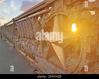 Metal star on the fence. The main symbol of the red Soviet army during the Second World War. Abstract background. The iron star symbol decoration is o Stock Photo