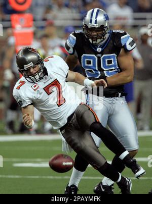 Detroit Lions' Dewayne White (99) goes up against Washington