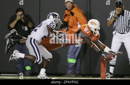 Oklahoma State tight end Brandon Pettigrew, left, wide receiver Dez Bryant  (1) can't come up with a pass in the end zone as Texas Tech safety Darcel  McBath (7) defends during the