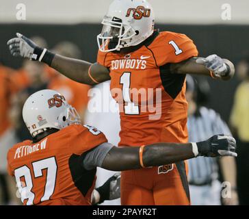 Oklahoma State tight end Brandon Pettigrew, left, wide receiver Dez Bryant  (1) can't come up with a pass in the end zone as Texas Tech safety Darcel  McBath (7) defends during the