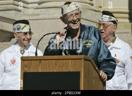 Paul Goodyear, left, a survivor of the USS Oklahoma, explains the ...