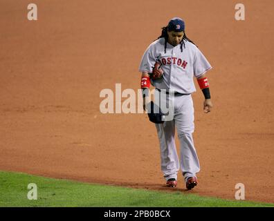 Boston Red Sox left fielder Manny Ramirez stretches before batting