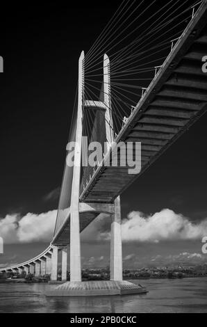 Passing under the Tsubasa Bridge across the Mekong River in Kandal Province, Cambodia. Stock Photo