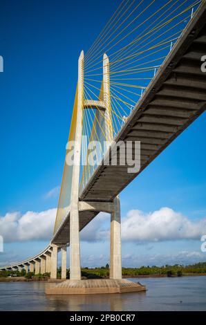 Passing under the Tsubasa Bridge across the Mekong River in Kandal Province, Cambodia. Stock Photo