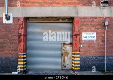 Roller shutter entrance to industrial loading area Stock Photo - Alamy