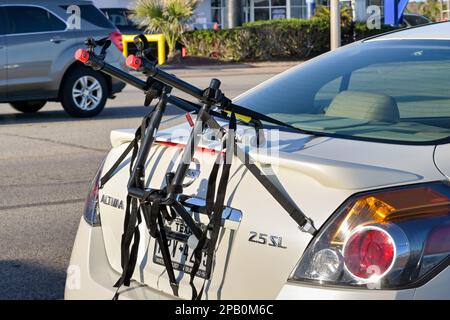 Galveston, Texas, USA - February 2023: Empty bicycle rack attached to the rear of a car Stock Photo