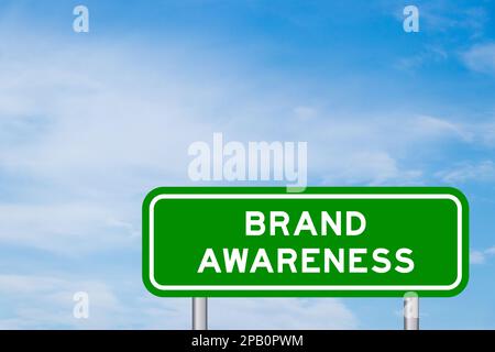 Green color transportation sign with word brand awareness on blue sky with white cloud background Stock Photo